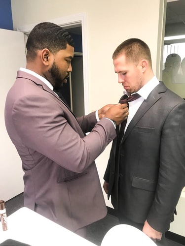 Team member at Ascension Management, Inc tying Tie - Direct Marketing Firm Staten Island