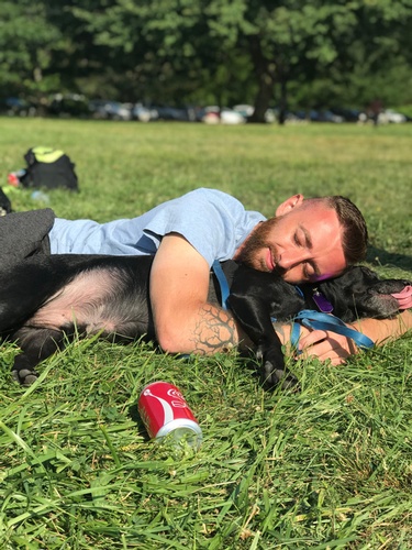 Chris - Team Leader at Ascension Management, Inc hugging a dog in Lawn - Direct Sales Firm New York